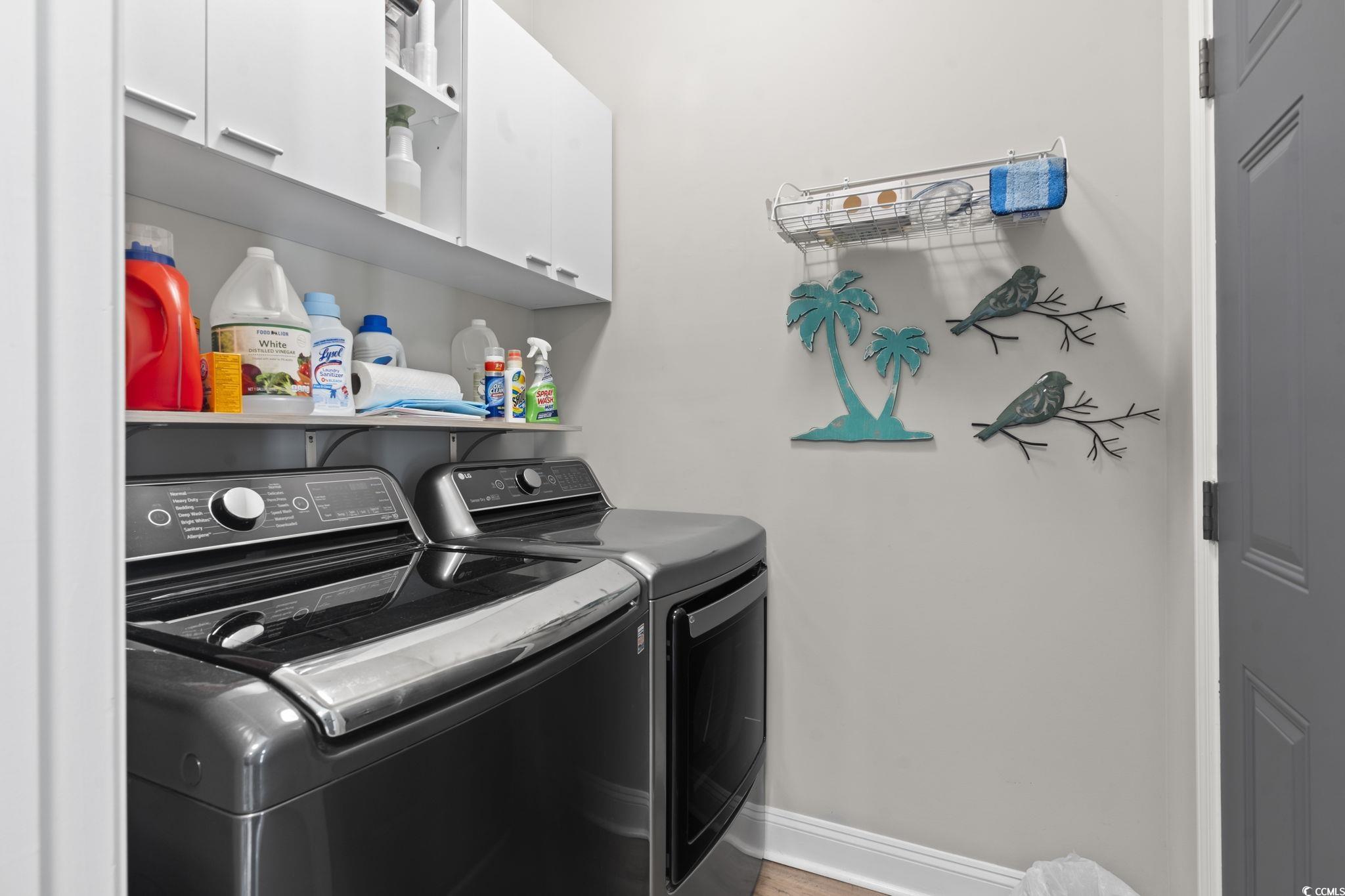 804 Twickenham Loop Longs, SC 29568 - Photo 20 of 26 Full bath featuring vanity, curtained shower, and wood finished floors