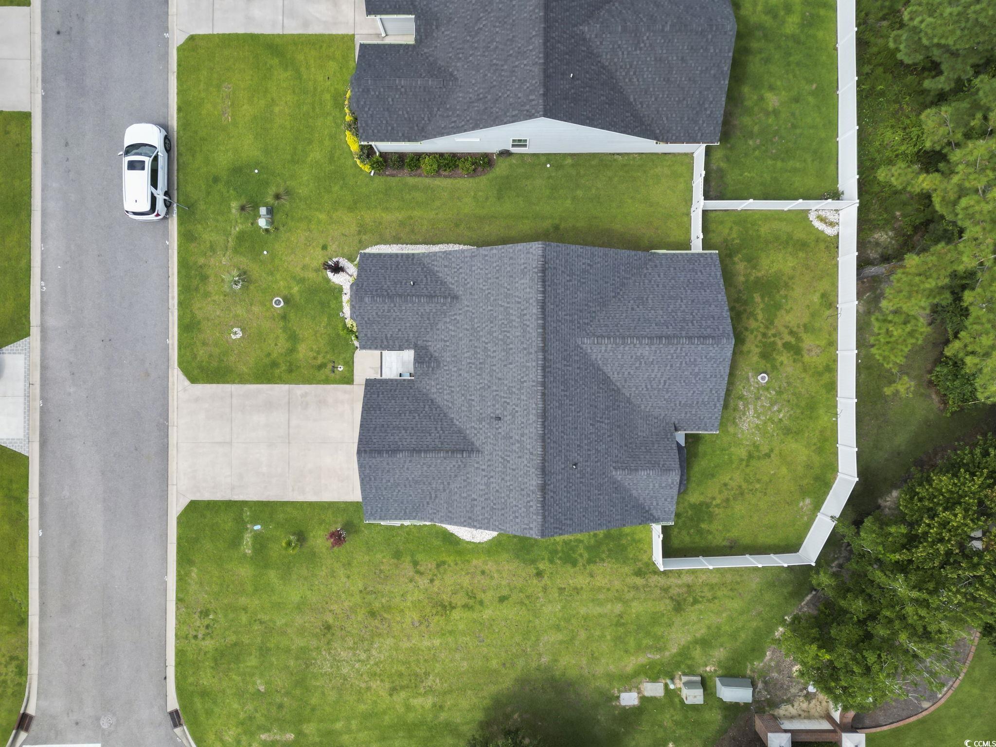 804 Twickenham Loop Longs, SC 29568 - Photo 24 of 26 Garage featuring a garage door opener