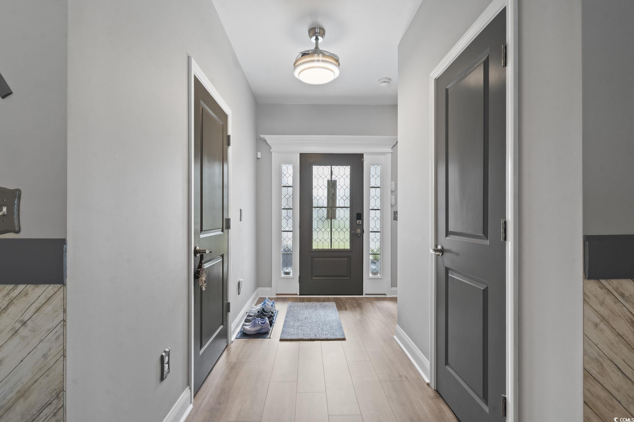 804 Twickenham Loop Longs, SC 29568 - Photo 5 of 26 Foyer entrance with baseboards and light wood-style flooring
