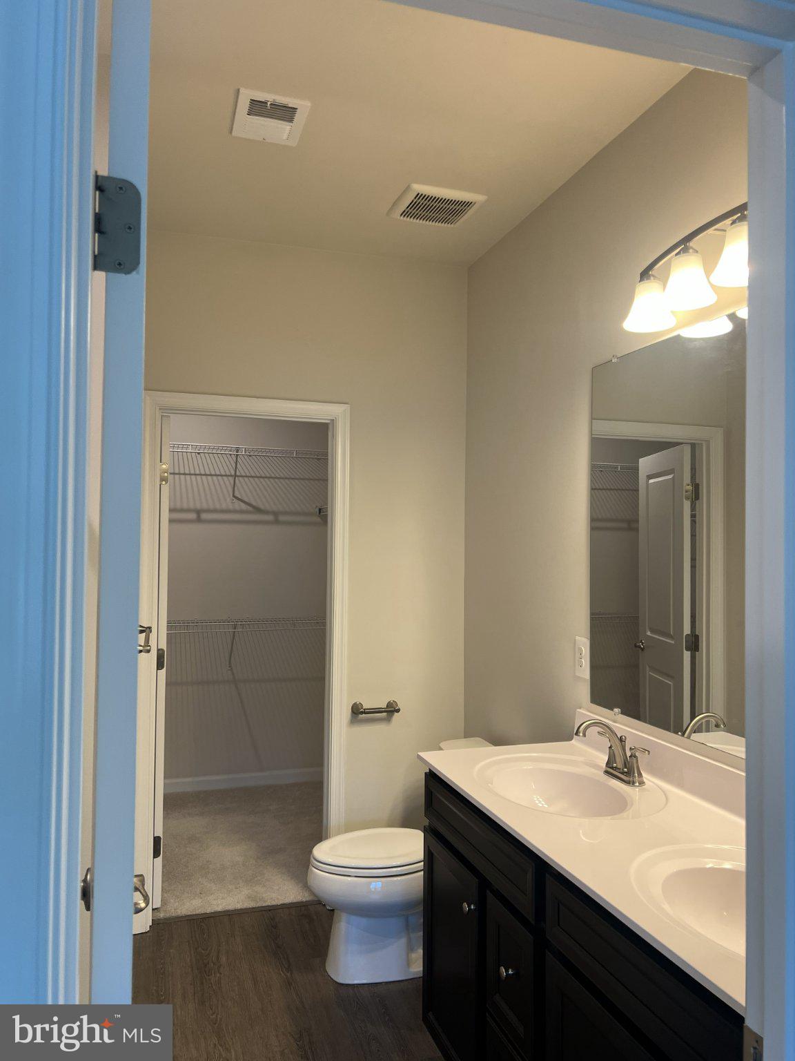 8058 Big Roundtop Road Fort George G Meade, MD 20755 - Photo 15 of 24 a bathroom with a sink a toilet and shower