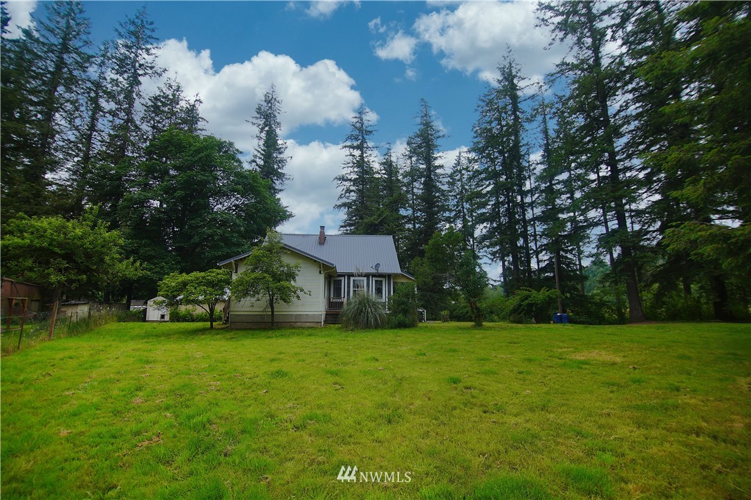 12910 Trout Farm Road Sultan, WA 98294 - Photo 3 of 20 a view of a house with a yard and sitting area