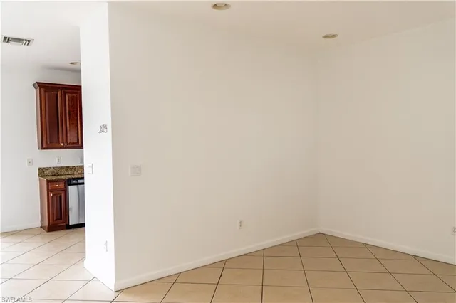 a view of a kitchen with white cabinets