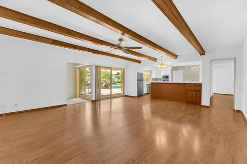 a kitchen with stainless steel appliances kitchen island granite countertop a stove and a sink