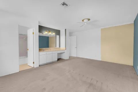 a swimming pool with outdoor seating and yard