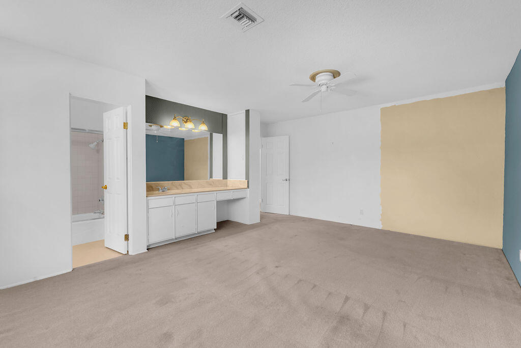 74075 Setting Sun Trail Palm Desert, CA 92260 - Photo 23 of 52 a view of a room with large mirror and window