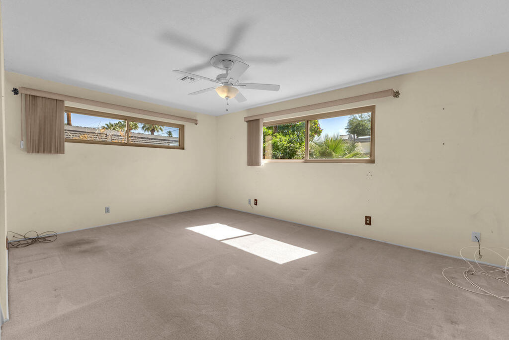 74075 Setting Sun Trail Palm Desert, CA 92260 - Photo 26 of 52 a view of an empty room with a window