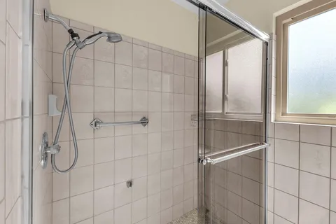 an aerial view of residential houses with outdoor space