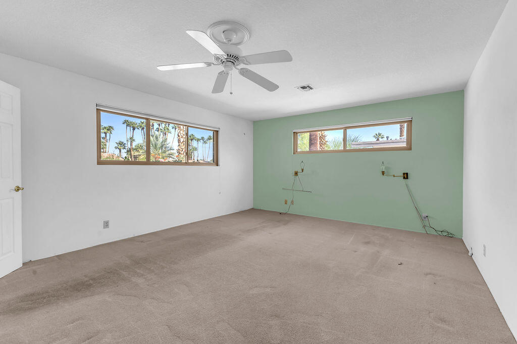 74075 Setting Sun Trail Palm Desert, CA 92260 - Photo 29 of 52 a view of an empty room with a window