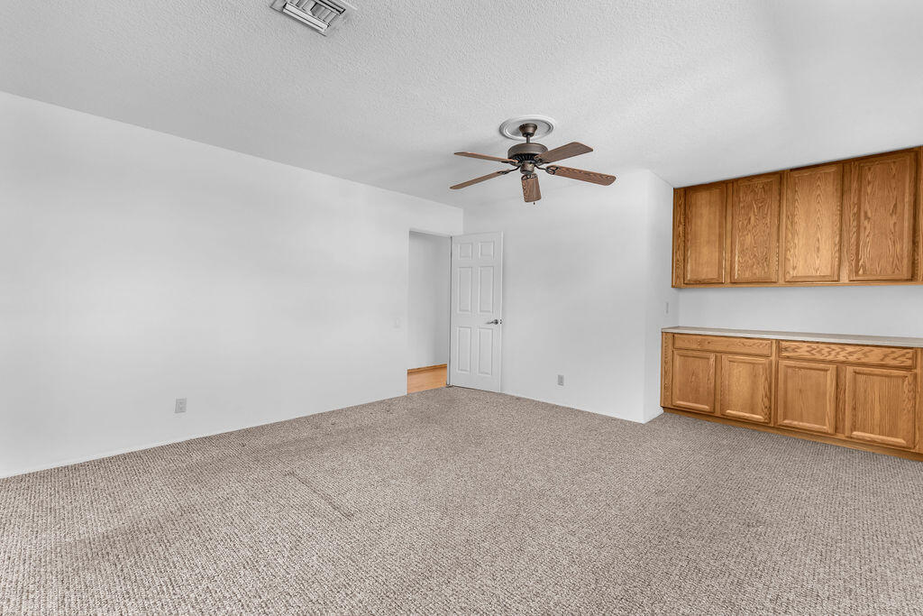 74075 Setting Sun Trail Palm Desert, CA 92260 - Photo 34 of 52 a view of an empty room with a window