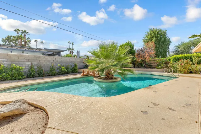 an aerial view of residential house with outdoor space and swimming pool