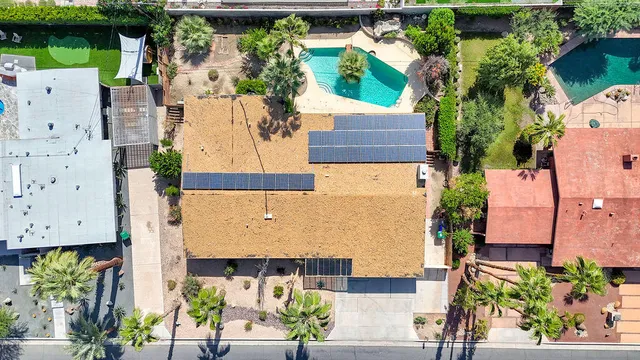 an aerial view of residential houses with outdoor space