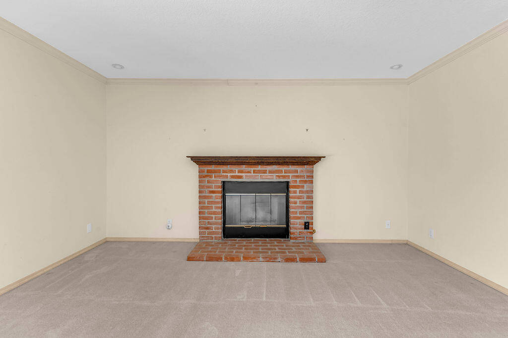 74075 Setting Sun Trail Palm Desert, CA 92260 - Photo 7 of 52 a view of an empty room with a fireplace