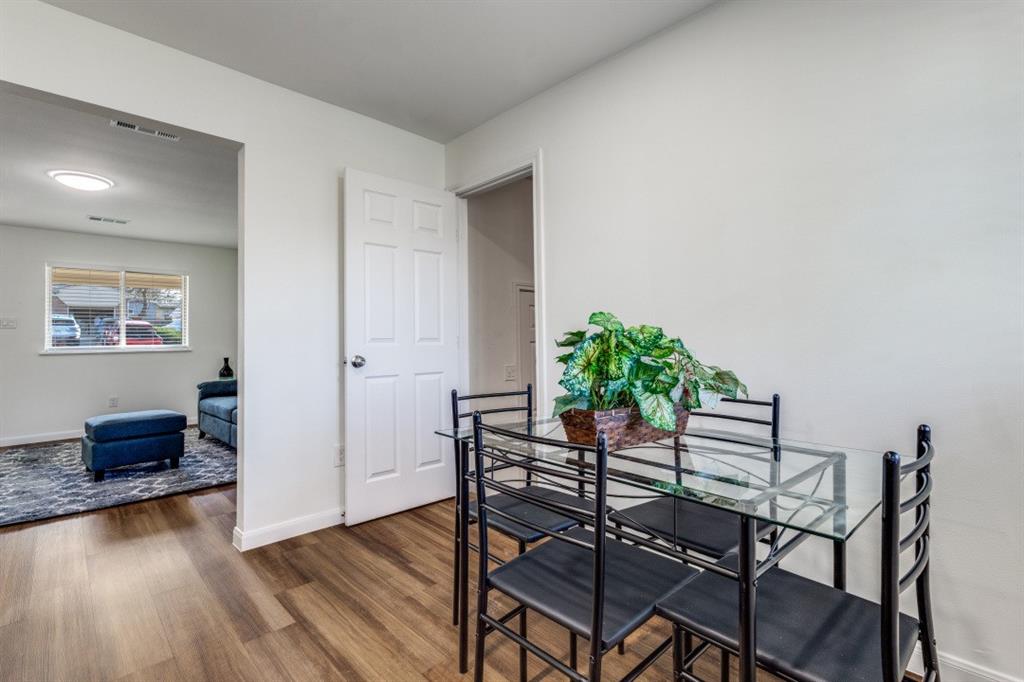 2663 Springvale Drive Farmers Branch, TX 75234 - Photo 13 of 25 a dining room with furniture and wooden floor
