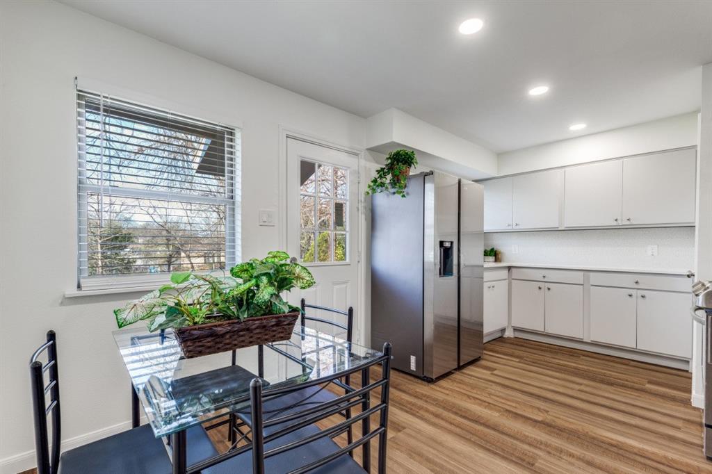 2663 Springvale Drive Farmers Branch, TX 75234 - Photo 14 of 25 a kitchen with stainless steel appliances a refrigerator and a table