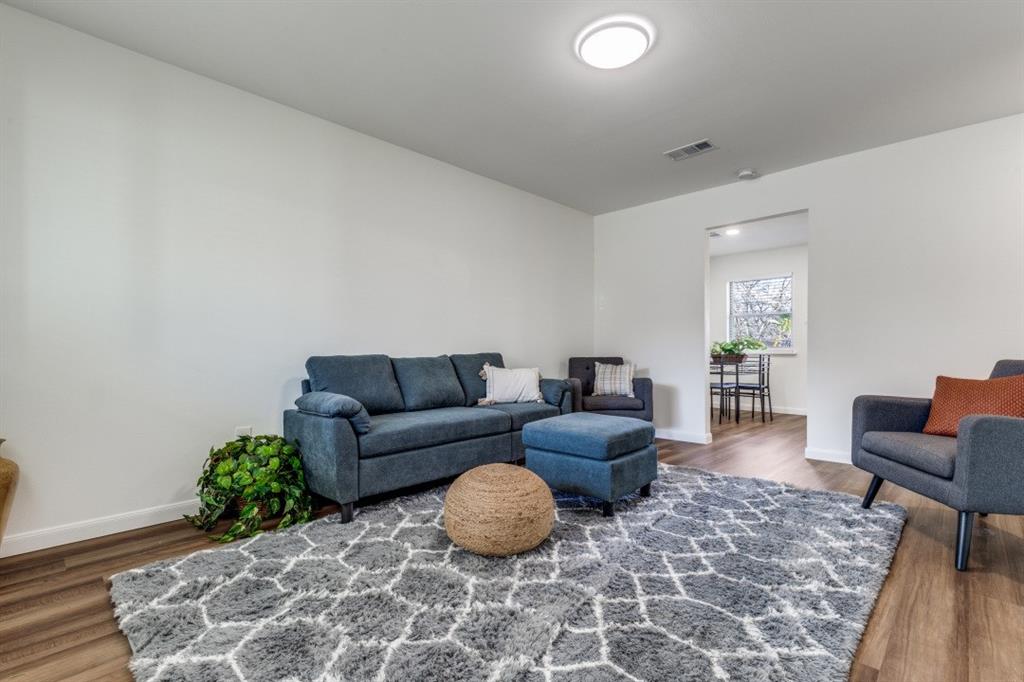 2663 Springvale Drive Farmers Branch, TX 75234 - Photo 7 of 25 a living room with furniture and a couch
