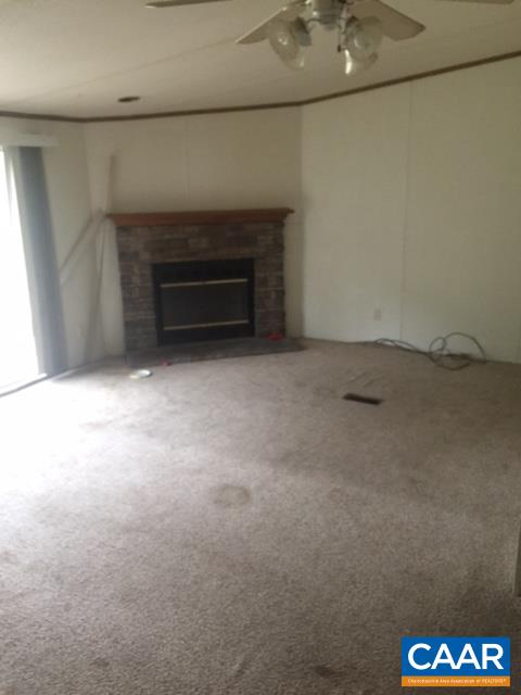 1479 Hunters Lodge Road Troy, VA 22974 - Photo 3 of 13 a view of empty room with a fireplace