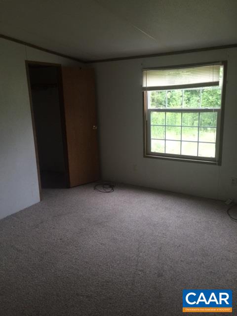 1479 Hunters Lodge Road Troy, VA 22974 - Photo 6 of 13 an empty room with a window