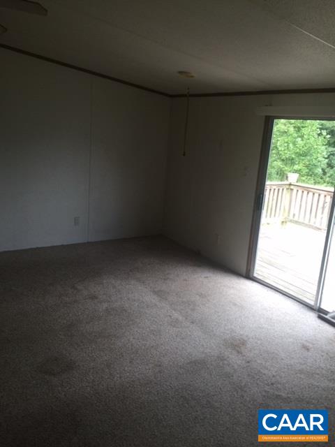 1479 Hunters Lodge Road Troy, VA 22974 - Photo 8 of 13 a view of an empty room with a window