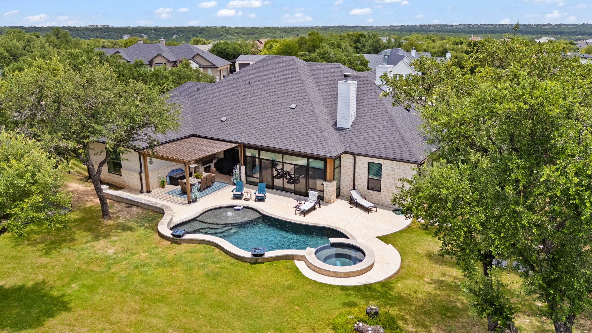 104 Lower Cedar Cove Georgetown, TX 78633 - Photo 2 of 37 a view of a house with pool and chairs