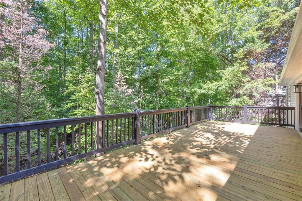 2941 Lake Hollow Road Gainesville, GA 30501 - Photo 37 of 53 a view of balcony with wooden floor and fence