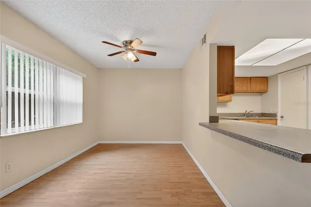 a view of a kitchen with a sink and a window