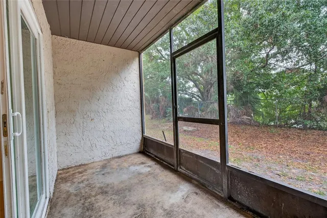 a view of a porch with a tree