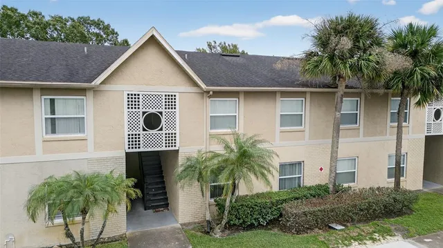 a view of a house with a yard and plants