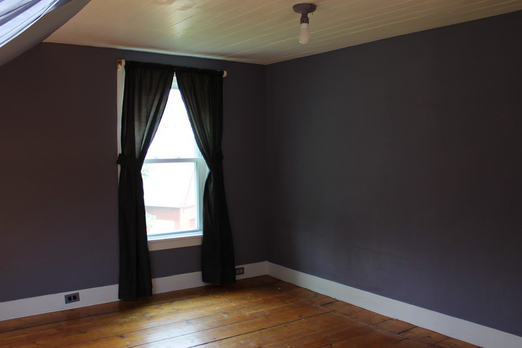 177 Number 9 Road Heath, MA 01367 - Photo 15 of 26 an empty room with wooden floor and windows
