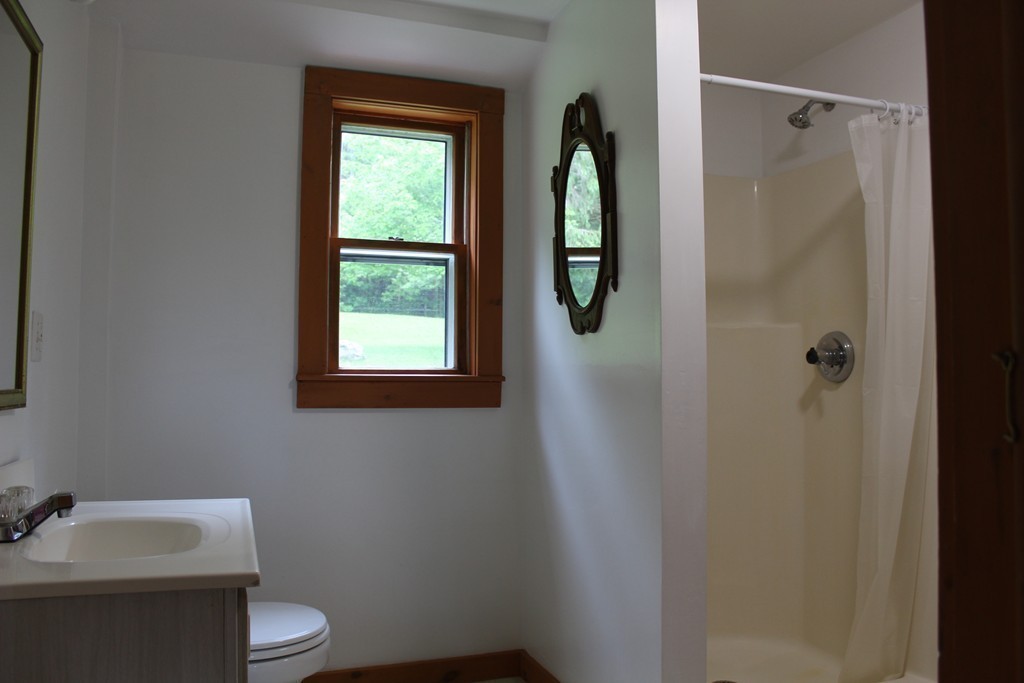 177 Number 9 Road Heath, MA 01367 - Photo 23 of 26 a bathroom with a toilet sink and shower