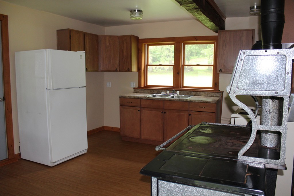 177 Number 9 Road Heath, MA 01367 - Photo 6 of 26 a kitchen with a refrigerator and a stove