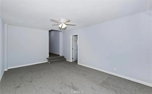 a view of a big room with carpet