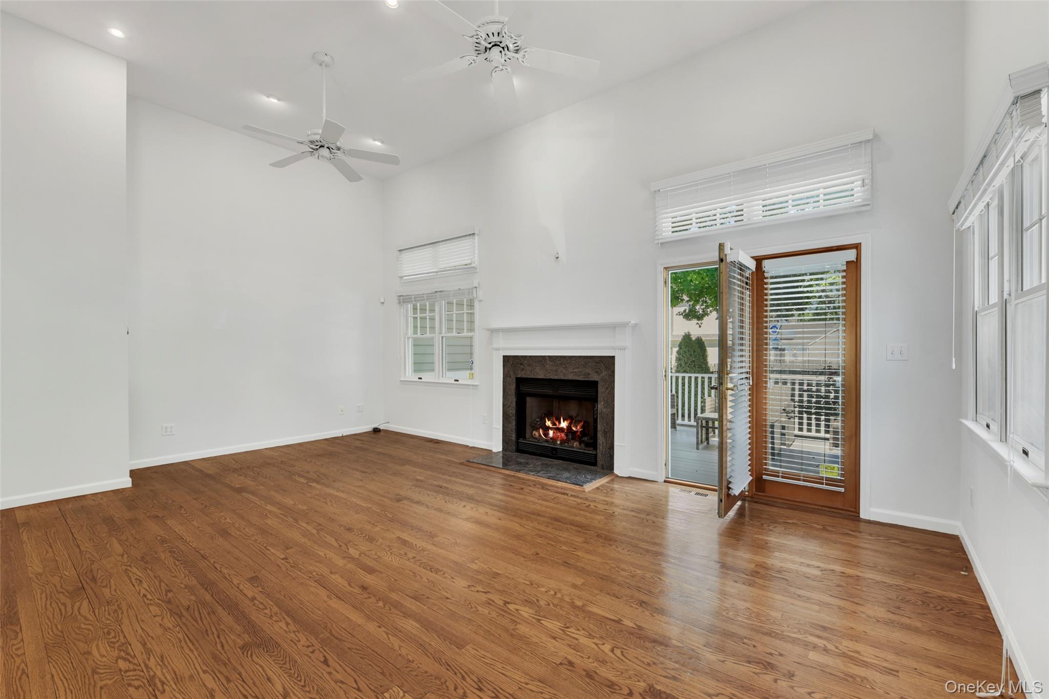21 Brookridge Court Rye Brook, NY 10573 - Photo 5 of 20 Living room features a gas fireplace.