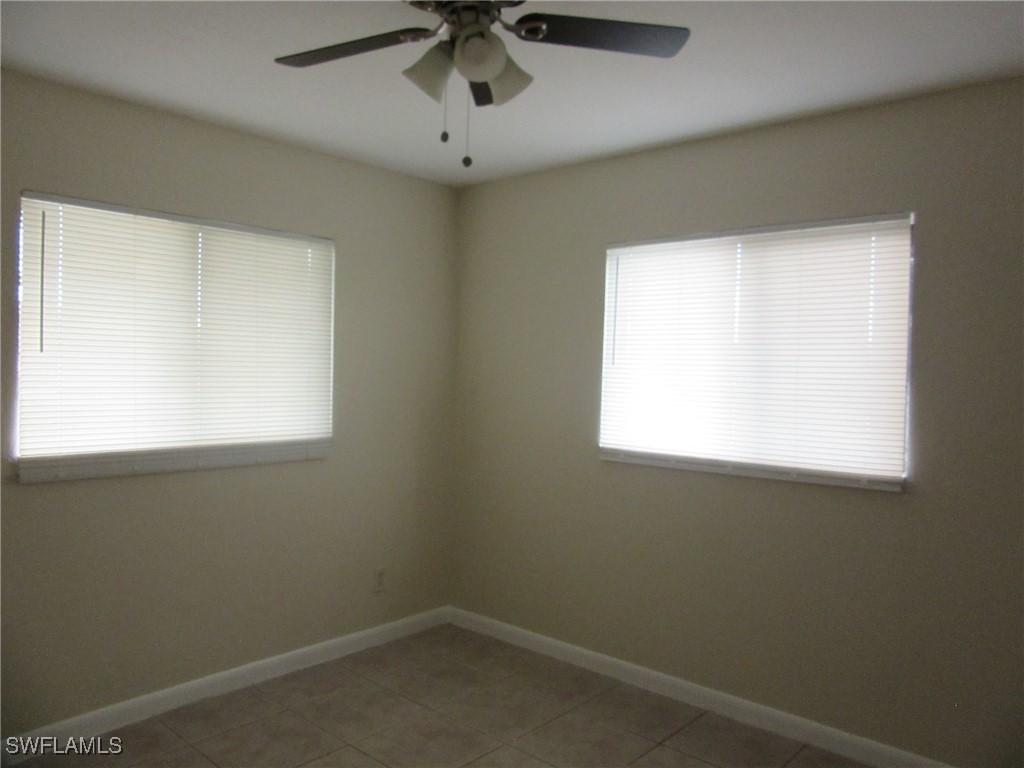 3215 Skyline Boulevard, Unit C Cape Coral, FL 33914 - Photo 11 of 25 an empty room with a window