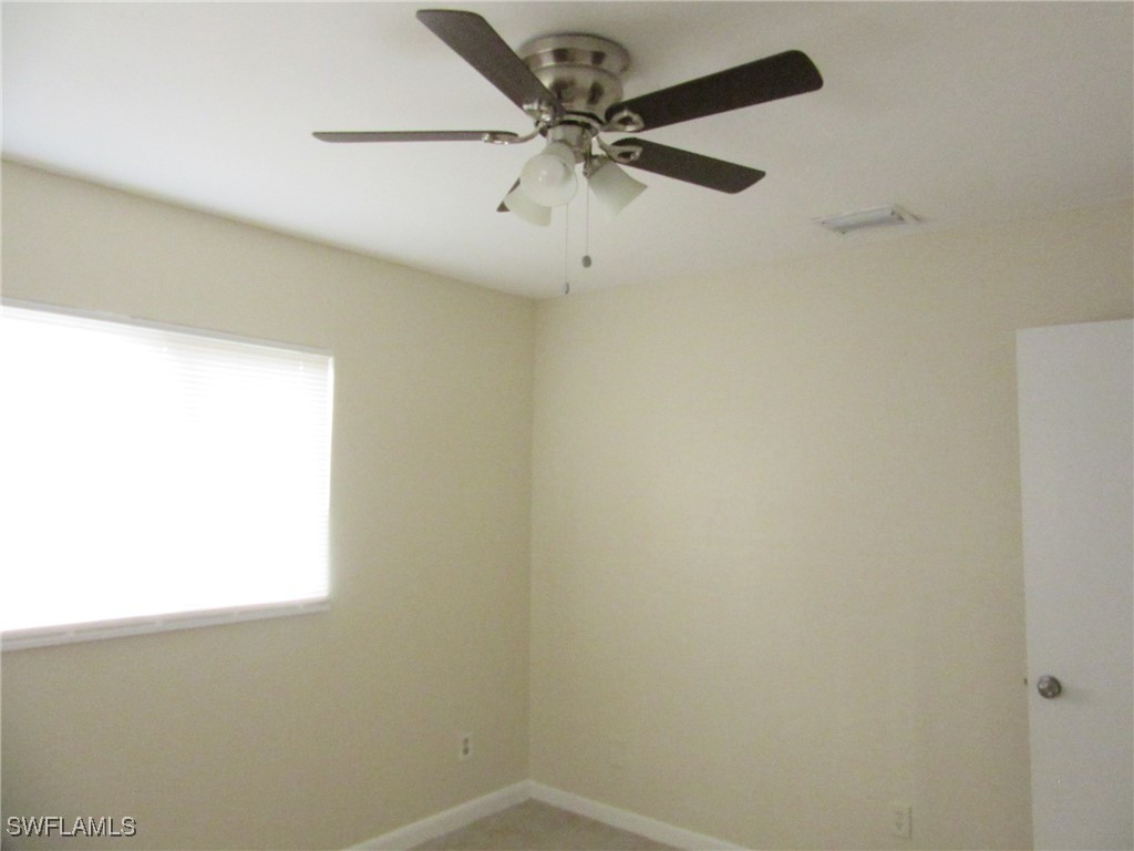 3215 Skyline Boulevard, Unit C Cape Coral, FL 33914 - Photo 12 of 25 a view of a window in an empty room