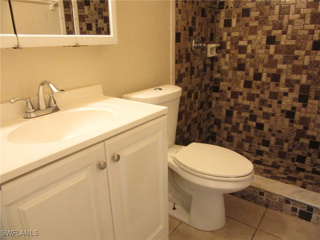3215 Skyline Boulevard, Unit C Cape Coral, FL 33914 - Photo 15 of 25 a bathroom with a sink and a toilet