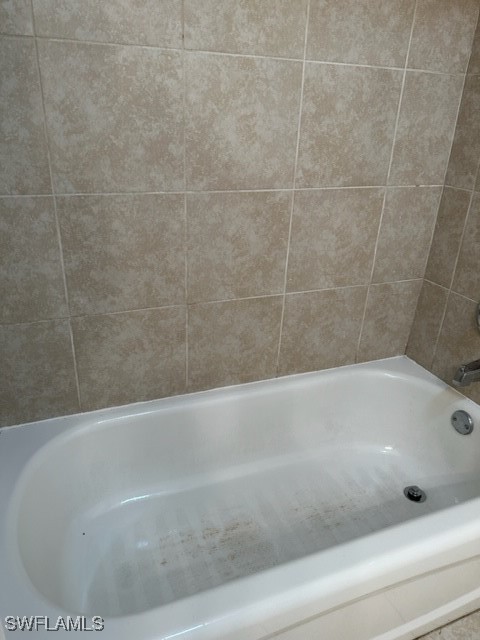 3215 Skyline Boulevard, Unit C Cape Coral, FL 33914 - Photo 23 of 25 a bathroom with a bathtub