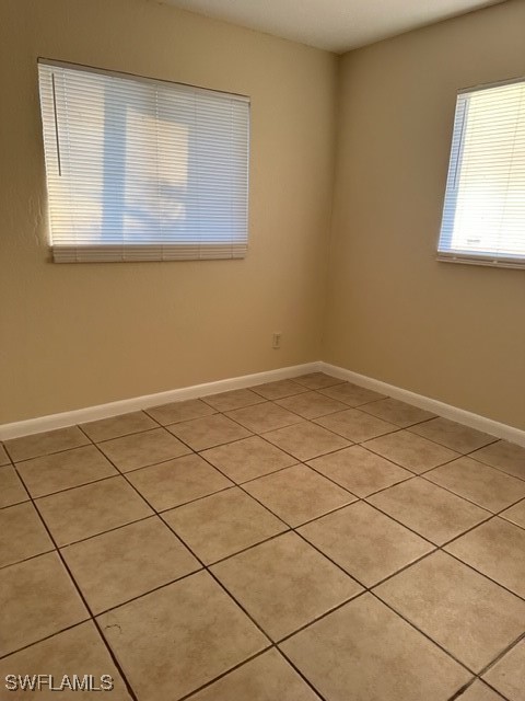 3215 Skyline Boulevard, Unit C Cape Coral, FL 33914 - Photo 24 of 25 a view of a room that has a window and white walls