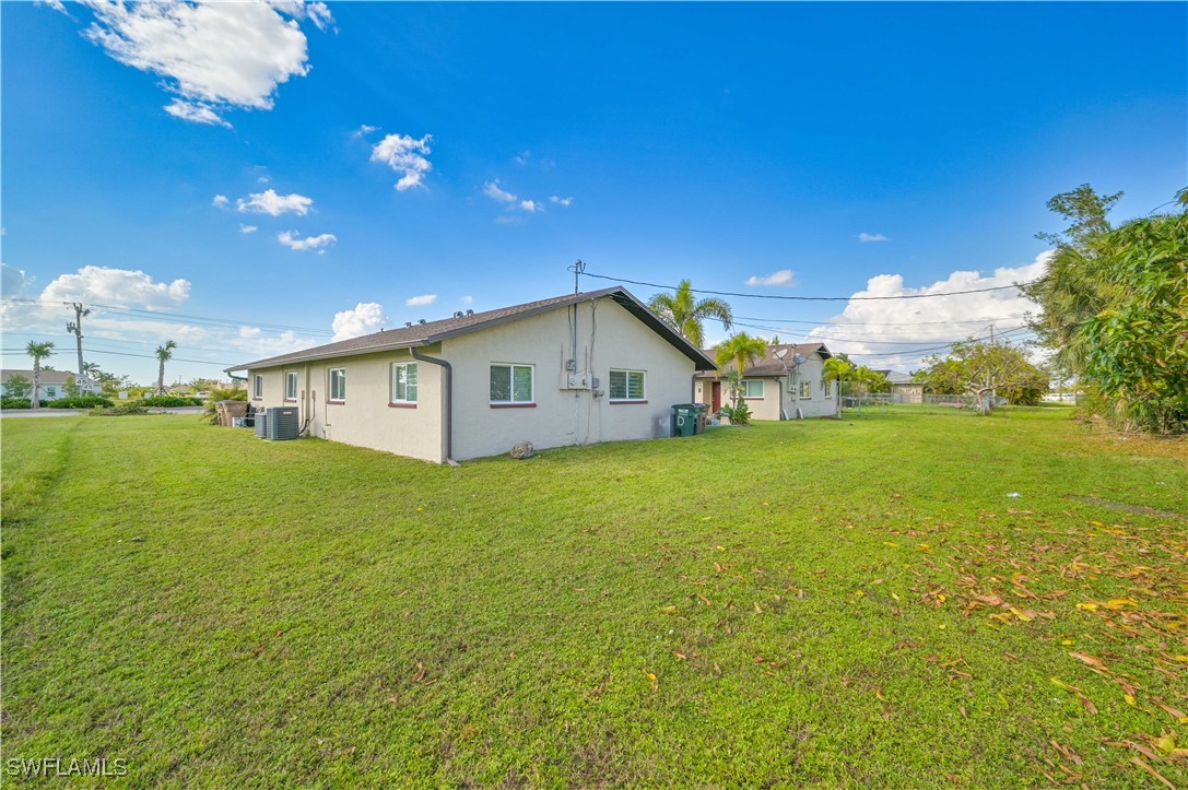 3215 Skyline Boulevard, Unit C Cape Coral, FL 33914 - Photo 3 of 25 a view of a house with backyard and garden
