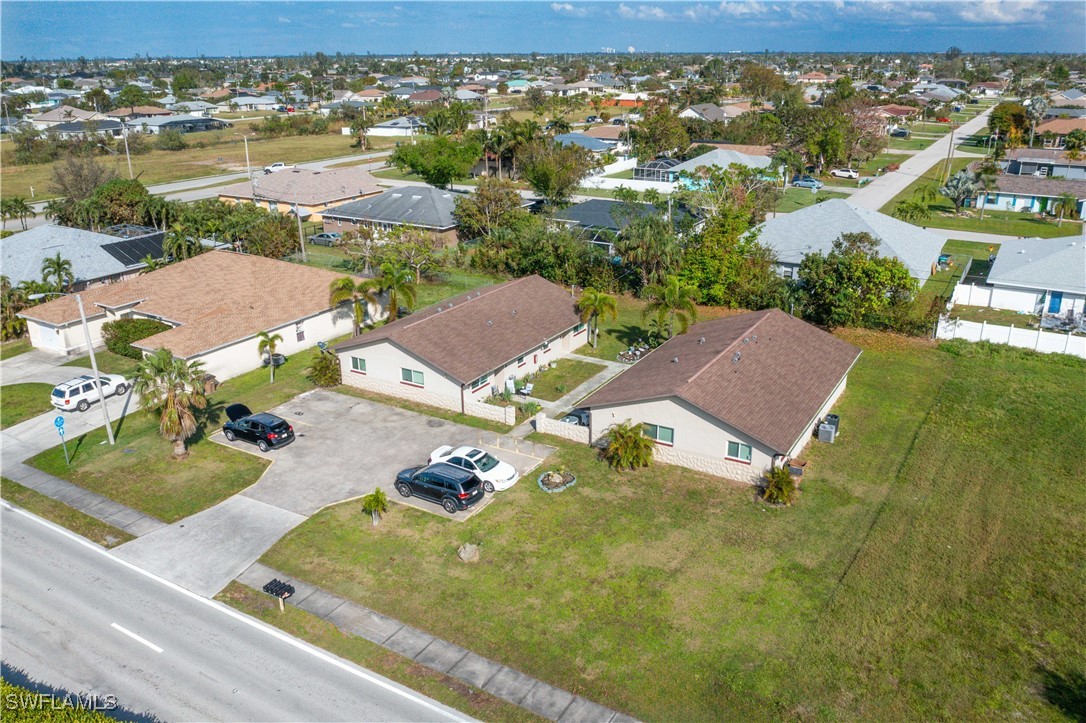 3215 Skyline Boulevard, Unit C Cape Coral, FL 33914 - Photo 5 of 25 an aerial view of residential houses with outdoor space