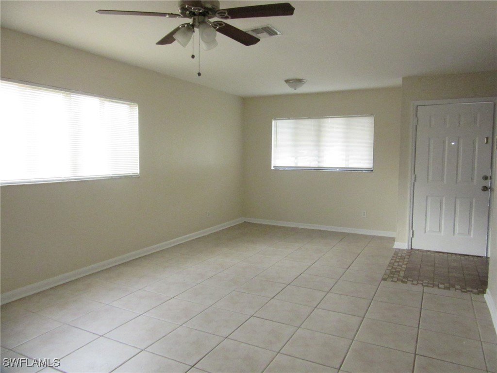 3215 Skyline Boulevard, Unit C Cape Coral, FL 33914 - Photo 10 of 25 a view of an empty room with a window