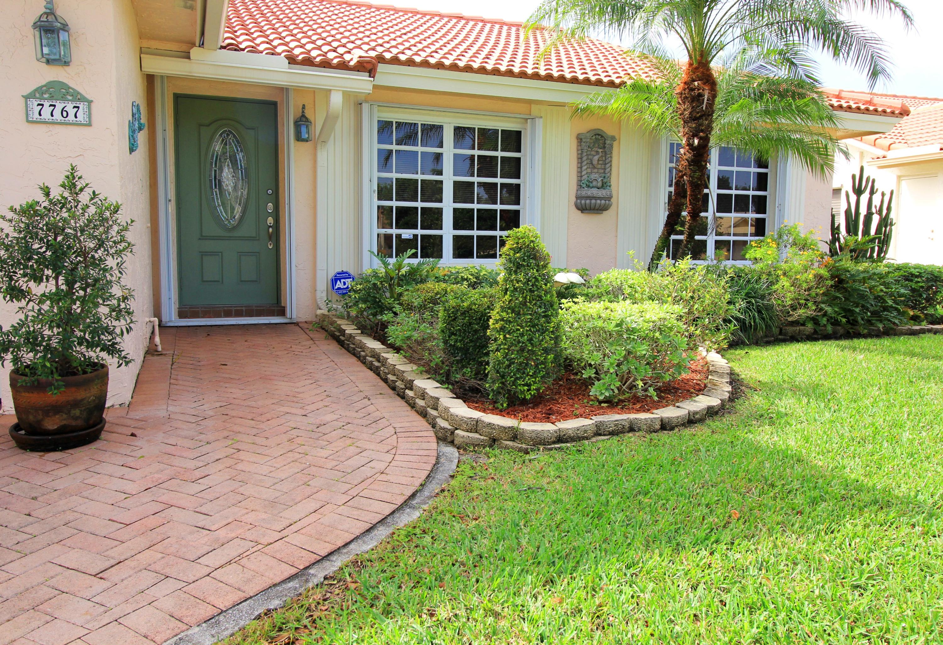 7767 Cloverfield Circle Boca Raton, FL 33433 - Photo 2 of 27 7767 Cloverfield Cir_front path