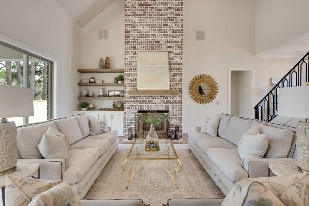 597 Cedar Shadows Circle West Collierville, TN 38017 - Photo 12 of 36 a living room with furniture a fireplace and a large window