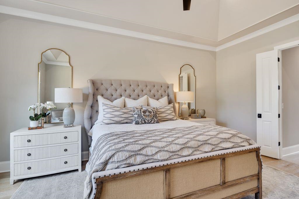 597 Cedar Shadows Circle West Collierville, TN 38017 - Photo 21 of 36 a bedroom with a bed and a dresser