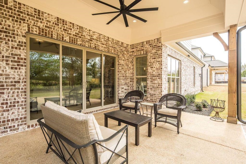 597 Cedar Shadows Circle West Collierville, TN 38017 - Photo 31 of 36 a building outdoor space with patio furniture