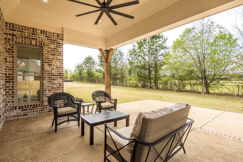 597 Cedar Shadows Circle West Collierville, TN 38017 - Photo 32 of 36 a view of a patio with a table and chairs