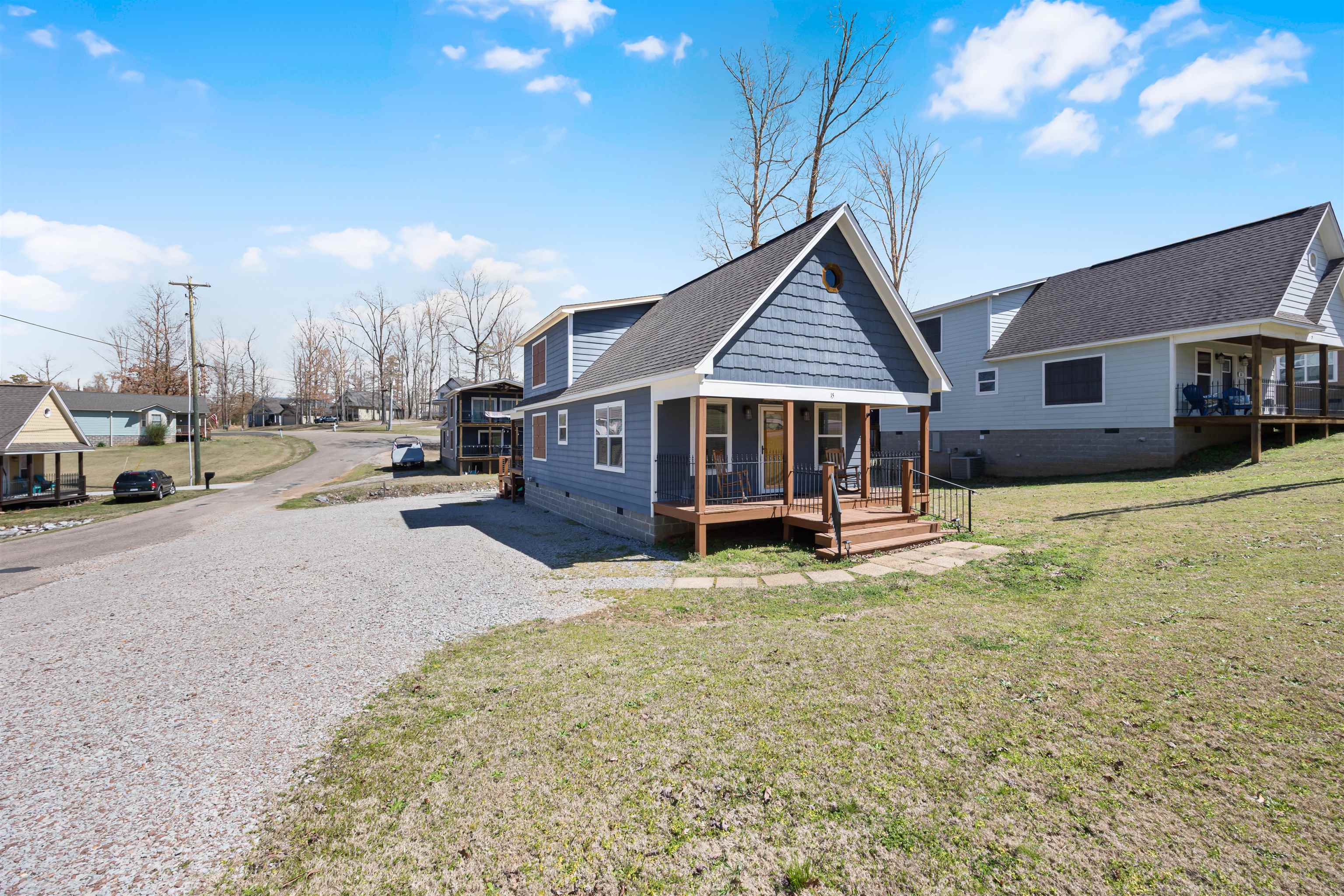 15 Bogey Loop Counce, TN 38326 - Photo 1 of 17 View of front of house with crawl space, a front yard, roof with shingles, a residential view, and a porch