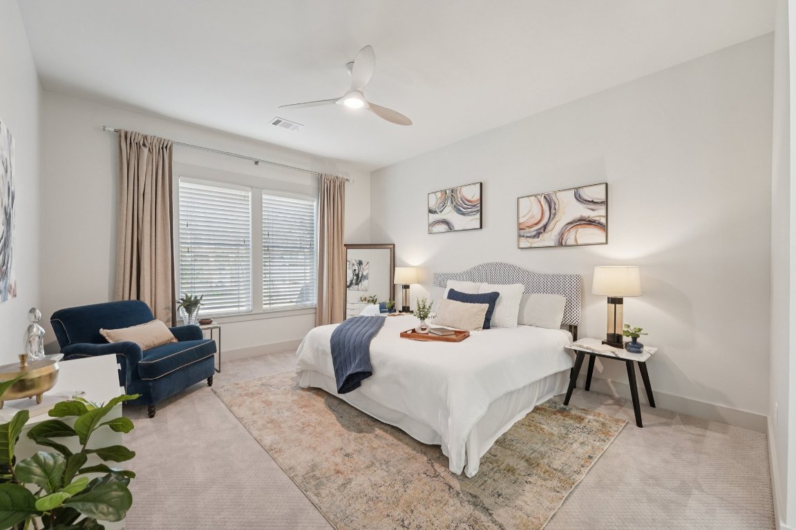 3711 Cedar Street Austin, TX 78705 - Photo 12 of 40 a bedroom with a bed and a couch