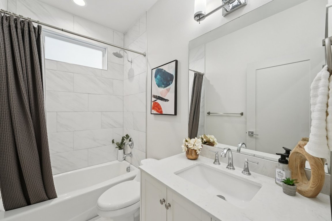 3711 Cedar Street Austin, TX 78705 - Photo 20 of 40 a bathroom with a sink a toilet and shower