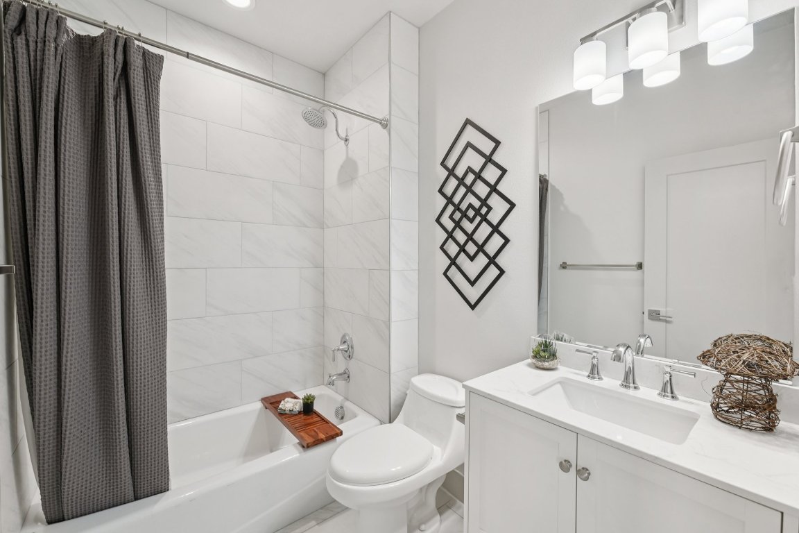 3711 Cedar Street Austin, TX 78705 - Photo 24 of 40 a bathroom with a sink toilet and shower