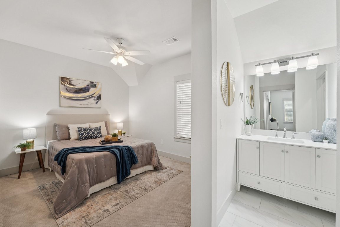 3711 Cedar Street Austin, TX 78705 - Photo 25 of 40 a bedroom with a bed and a chandelier